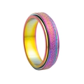 Macro shot of colorful rainbow spinner ring with matte frosted finish and polished inner band - Iridescent