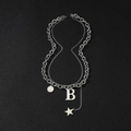 Double-layered silver titanium steel necklace featuring letter B and star pendants on black background - B-Letter Style