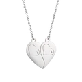 Detailed macro view of two interlocking heart pendants in polished silver stainless steel - Heart 3