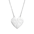 Macro detail of silver heart puzzle pendant featuring delicate hollow flower patterns - Snowflake