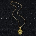 Golden monkey head pendant necklace with white zircons on a black stone background - Gold