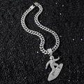 Silver iced out surfer pendant on cuban link chain with white stones over black stone background - Silver Jewelry Set