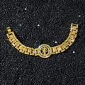 Hip Hop Armband Gold mit drehbarem Kreuzanhänger und Zirkonia auf schwarzem Stein - Drehbares Kreuz / Gold