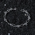 Minimalist silver chain bracelet with geometric links on black pebble background - Bracelet (20 cm)