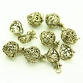 Vintage brass hollow heart locket pendants with intricate filigree pattern for DIY jewelry - Antique Bronze