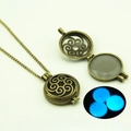 Detail of antique bronze filigree locket with glowing blue luminous stone bead - Blue Glow (YJ10-6108)