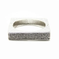 Macro shot of silver square bracelet featuring micro-pave diamonds and hammered texture - Silver