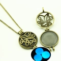 Detailed view of bronze hollow locket pendant showing the blue glowing effect in the dark - Vines Hollow Style (YJ10-6103) / Blue