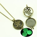Locket necklace detail showing vintage openwork design and green glow in the dark stone - Leaves Hollow Style (YJ10-6105) / Green