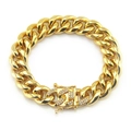 Macro view of hip-hop gold Cuban link bracelet featuring a diamond-encrusted clasp detail - Gold-8inch