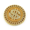 Macro view of gold hip-hop dollar sign medallion with sparkling rhinestone inlay - Gold / 6.5cm