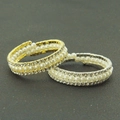 Detailed view of layered spiral bracelets featuring pearl rows and rhinestone edges - Gold Style 3