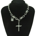 Close-up of punk style silver chain with barbed wire details and a cross pendant - Silver