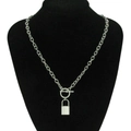 Polished silver lock pendant necklace with OT toggle clasp on a black mannequin display - Silver