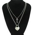 Double-layer silver necklace featuring creative heart lock and key pendants on black bust - Silver