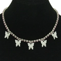 Y2K style silver necklace featuring five pink rhinestone butterflies on a black neck model - Silver Chain Pink Rhinestone