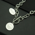 Detailed macro of stainless steel OT buckle and engraved pendants for hiphop necklace - BELIEVE Oval Double (Style 2)