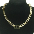 Gold chunky chain necklace with B-shaped pendant on black mannequin display - Gold