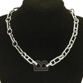 Silver chunky chain necklace with bold black B letter pendant on black mannequin - Silver