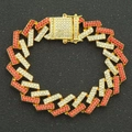 Macro view of golden Cuban link bracelet with red and white rhinestones and a square clasp - Gold (Red Rhinestone)