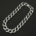 Close-up of silver Cuban link necklace with sparkling pavé rhinestones on black background - Silver Necklace / Silver