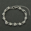 Silver stainless steel paperclip chain bracelet with adjustable lobster clasp on black background - Bracelet / Steel