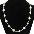 Detail of fashion necklace with white pearls and silver metal beads on a black neck bust - Pearl + Bead Chain - Necklace