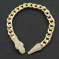 Golden snake head Cuban link bracelet encrusted with sparkling white cubic zirconia crystals - Black Eye Bracelet / Gold