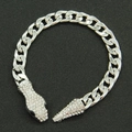 Detailed view of silver curb chain bracelet featuring rhinestone-encrusted snake head clasp - Snake Bracelet / Silver (Black Eyes)