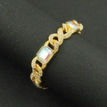 Macro detail of gold Cuban link bracelet with colorful rectangular AB crystals and pavé rhinestones - Gold
