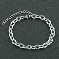 Minimalist silver oval link chain bracelet with adjustable lobster clasp on black background - Steel Color - 7inch