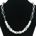 Barbed wire and pearl necklace with chunky silver chain on a black jewelry stand - Pearl Splicing Necklace