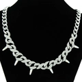 Bold Cuban link necklace with thorns and rhinestones on black display stand - 8-Shaped Buckle Cuban Necklace / Silver