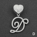 Macro shot of silver hip-hop pendant with iced out heart and cursive D letter detail - Letter D / Silver