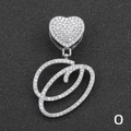 Macro detail of iced-out silver letter O pendant with heart buckle on Cuban chain - Letter O / Silver