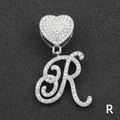 Close-up of hip hop silver letter R pendant with full diamond paving and heart clasp - Letter R / Silver