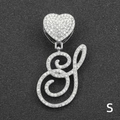 Close-up of iced out heart clasp and cursive letter S pendant with silver tone rhinestones - Letter S / Silver