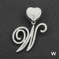 Close-up of iced out cursive letter W pendant with heart clasp on black texture - Letter W / Silver