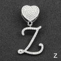 Macro detail of iced-out silver cursive letter Z pendant with heart buckle and clear zircons - Letter Z / Silver