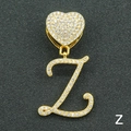 Macro shot of gold-plated letter Z pendant with heart-shaped diamond buckle details - Letter Z / Gold