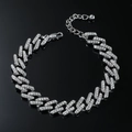 Sparkling silver cuban link anklet with full diamond rhinestones on black reflective surface - Silver