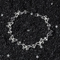 Bracelet chaîne à maillons papillon en acier inoxydable sur fond de cristaux noirs - Bracelet (21cm)