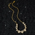 Collana hip-hop dorata con cuori di cristallo ghiacciati su sfondo di sabbia nera - 52cm / Collana / Oro
