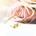 Detail of adjustable 18K gold box chain with positioning bead and metal hallmark - 925 Silver / Gold