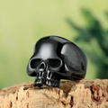 Gothic punk polished black stainless steel skull ring for men on a rustic wood base - US 7 / Black