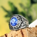 Detail of vintage US Army ring featuring a blue gemstone and eagle relief carvings - US 7 / Steel Color Light Blue Rhinestone