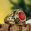 Golden United States Army military ring with red oval gemstone on rustic wood background - Gold Red Zirconia