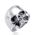 Detailed macro view of silver stainless steel skull ring with gothic punk head engraving - US 7 / Steel