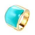 Detailed side view of a wide gold stainless steel ring featuring a square turquoise stone - Light Green Rhinestone
