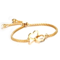 Pulsera ajustable de acero dorado con dos corazones entrelazados y cadena veneciana - Dorado